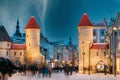 Tallinn, Estonia. Night Starry Sky Above Famous Landmark Viru Gate Gates. Street Lighting In Winter Holiday Evening