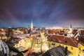 Tallinn, Estonia. Night Starry Sky Above Traditional Old Architecture Cityscape Skyline In Old Town. Winter Evening