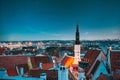 Tallinn, Estonia. Night Starry Sky Above Traditional Old Architecture Skyline In Old Town. Church Of Holy Ghost Or Holy Royalty Free Stock Photo