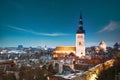 Tallinn, Estonia. Night Starry Sky Above Traditional Old Architecture Skyline In Old Town. St. Nicholas Church -