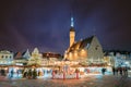 Tallinn, Estonia. Night Stars Sky Above Traditional Christmas Market And Carousel On Town Hall Square. Christmas Tree Royalty Free Stock Photo