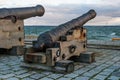 Tallinn, Estonia - November 18, 2018: Old cannons in the Maritime Museum of Tallinn. Cannon on wooden gun carriages