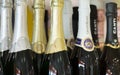 Tallinn Estonia - November 5th 2016: Cinzano gold, silver, white and black champagne bottles necks top caps at standing