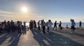 People relaxing and dancing Bachata on sunset at promenade on beach Baltic sea lifestyle scene weather forecast