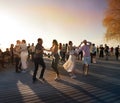 People relaxing and dancing Bachata on sunset at promenade on beach Baltic sea lifestyle scene weather forecast
