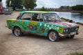 old car is painted in hippie style