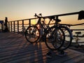 Tallinn, Estonia - 09.2019. silhouettes of a Bicycle against the sunset on the sea. Adults and children Cycling