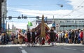 Estonian people in traditional clothing walking the streets of Tallinn