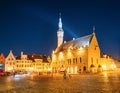 Tallinn, Estonia. Town Hall Square - Raekoja Plats. Famous Landmark In Evening Night Illumination Under Blue Sky. Royalty Free Stock Photo