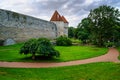 Tallinn medieval city wall turrets at sunset.