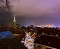 Tallinn old town at blue night full moon on blue sky blurring light on city horizon panorama Royalty Free Stock Photo