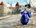 Tallinn old town hall square Estonia national flag symbols of a blue bouquet cornflower in blue vase  on street medieval houses r Royalty Free Stock Photo