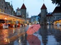 Tallinn  Old Town night   city light  pink umbrella  rainy season street evening lightening  blurring bokeh city  people walking Royalty Free Stock Photo