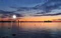 Tallinn . Old town Panorama starry night and moon light ,summer night seascape city  light reflexion on water in  harbor moon on b Royalty Free Stock Photo