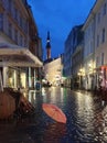 Night City Lights Rainy Season weather Tallinn Old Town Square Autumn evening in city street bokeh light  rainy night  umbrella Royalty Free Stock Photo