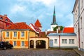 Tallinn old town streets with St. Olaf`s church Oleviste kirik at background, Estonia Royalty Free Stock Photo