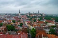 Tallinn Old Town and Toompea Hill, Estonia, panoramic view on rainy weather with traditional red tile roofs, medieval churches and Royalty Free Stock Photo