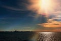 Tallinn panorama on horizon  Old town ,Sea sunset sunlight night sky moon light skyline evening light reflection on seawater gold Royalty Free Stock Photo