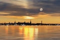 Tallinn panorama moon on pink sky on horizon Old town ,Sea gold sunset sunlight night sky moon light skyline evening light ref Royalty Free Stock Photo