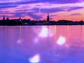 Tallinn Panorama at summer night seascape city  night light reflexion on water harbor moon on blue ske Old town Tallinn baltic sea Royalty Free Stock Photo