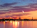 Tallinn panorama on sunset at starry night above sea ,Beautiful romantic starry night and full moon on blue sky at sea , and Royalty Free Stock Photo