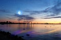 Tallinn panoramic Sunset starry sky moon stars sunset summer starry    sky  night seascape city panorama night light on water harb Royalty Free Stock Photo