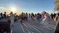 10.06.2022.Tallinn ,Reidi tee,Estonia,people relaxing and dancing bachata on beach promenade on sunset evening in Baltic sea