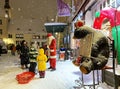 Tallinn Winter 06.12.2021 Christmas Snowy Street Santa and child scene city decoration Troika Restaurant bear symbol children with Royalty Free Stock Photo