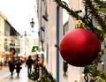 Winter holiday ,Christmas tree decorated red balls and illumination on street inllinn town Hall Square ,medieval buildings facade, Royalty Free Stock Photo