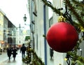 Winter holiday ,Christmas tree decorated red balls and illumination on street inllinn town Hall Square ,medieval buildings facade, Royalty Free Stock Photo