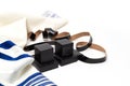 Tallith and tefillin on white background. Jewish ritual objects. Close up