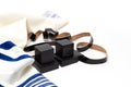 Tallith and tefillin on white background.Jewish ritual objects. Close up