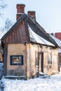 Talsi, Latvia - January 11, 2022: Interesting, very narrow house with painting on the wall in winter day Royalty Free Stock Photo