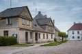 Talsi, Latvia - July 12, 2018: Colorful old town houses with lake reflection in cloudy summer day Royalty Free Stock Photo