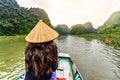 Tam Coc Natioanl Park - Vietnamese Girl traveling in boat along the Ngo Dong River at Ninh Binh Province, Trang An landscape Royalty Free Stock Photo