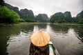 Tam Coc Natioanl Park - Vietnamese Girl traveling in boat along the Ngo Dong River at Ninh Binh Province, Trang An landscape Royalty Free Stock Photo