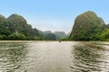 Tam Coc Natioanl Park - Vietnamese Girl traveling in boat along the Ngo Dong River at Ninh Binh Province, Trang An landscape Royalty Free Stock Photo