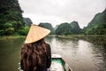 Tam Coc Natioanl Park - Vietnamese Girl traveling in boat along the Ngo Dong River at Ninh Binh Province, Trang An landscape Royalty Free Stock Photo