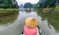 Tam Coc Natioanl Park - Vietnamese Girl traveling in boat along the Ngo Dong River at Ninh Binh Province, Trang An landscape Royalty Free Stock Photo