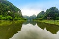 Tam Coc Natioanl Park - Vietnamese Girl traveling in boat along the Ngo Dong River at Ninh Binh Province, Trang An landscape Royalty Free Stock Photo