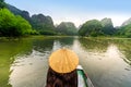 Tam Coc Natioanl Park - Vietnamese Girl traveling in boat along the Ngo Dong River at Ninh Binh Province, Trang An landscape Royalty Free Stock Photo