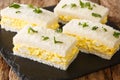 Tamago Sando is a very humble snack, modest, low maintenance and very convenient. The Japanese Egg Sandwich close-up on a slate