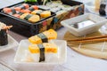 Tamagoyaki sushi or sweet egg on rice and seaweed wrap on square white plate. Delicious japanese food Royalty Free Stock Photo