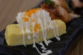 Tamako on black tray, Japanese sushi food