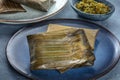 Tamales, traditional dish of Mexican cuisine, wrapped in green leaves