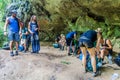 TAMAN NEGARA, MALAYSIA - MARCH 16, 2018: Tourists rest in a small cave in the jungle of Taman Negara national par