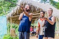 TAMAN NEGARA, MALAYSIA - MARCH 17, 2018: Tourists trying a blow pipe in an indigenous village in Taman Negara national