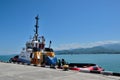 Tamarai tugboat docked on seaside harbor with crew members inside port Batumi Georgia