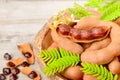 Tamarind fruits and fresh leaves on the wooden board