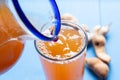 Tamarind water in glass on blue background